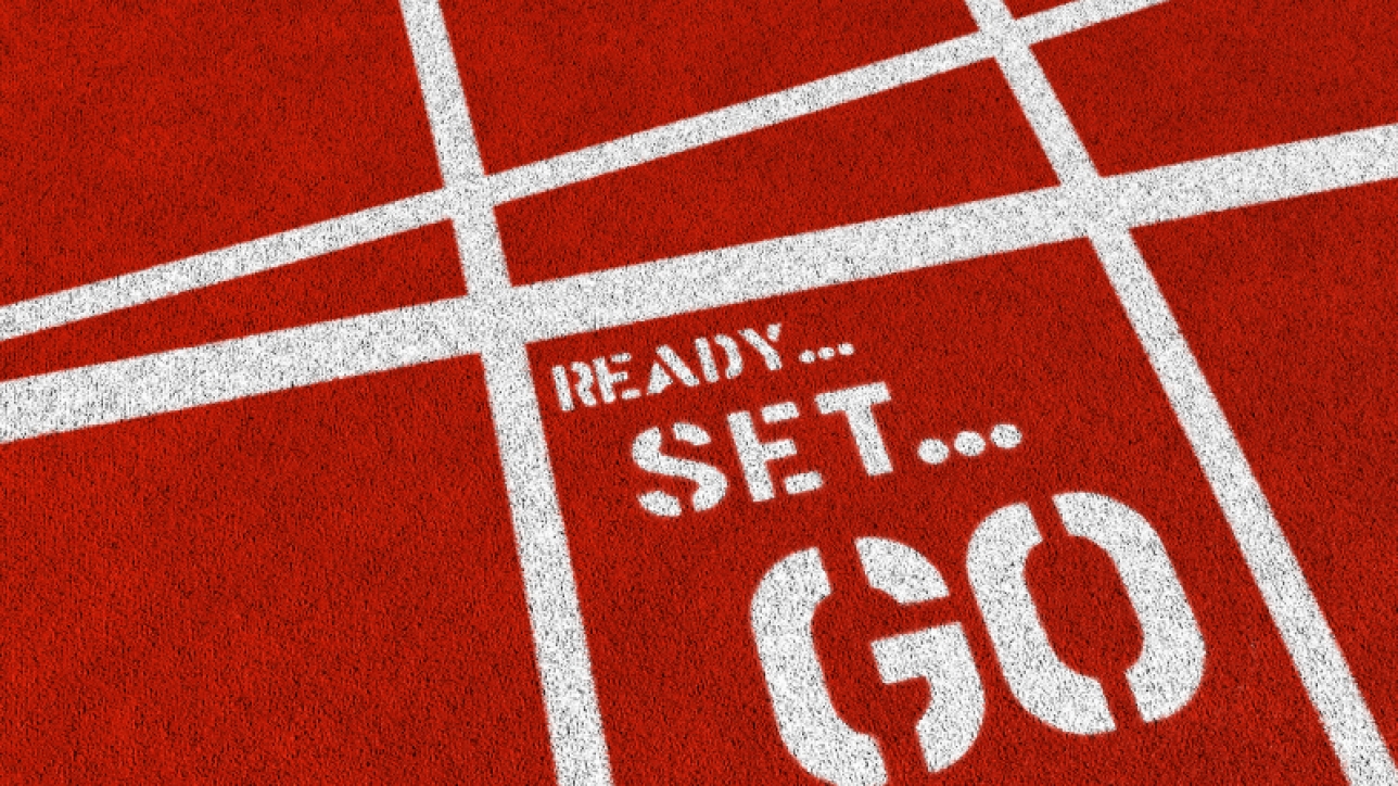 The words READY SET GO on a synthetic athletics track. 3D render with HDRI lighting and raytraced textures.